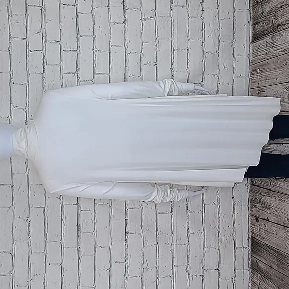 Free People Uptown Long Sleeve Cut Out Turtleneck Sweater Top in Ivory - NWT