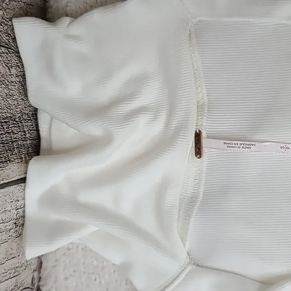 Free People Uptown Long Sleeve Cut Out Turtleneck Sweater Top in Ivory - NWT