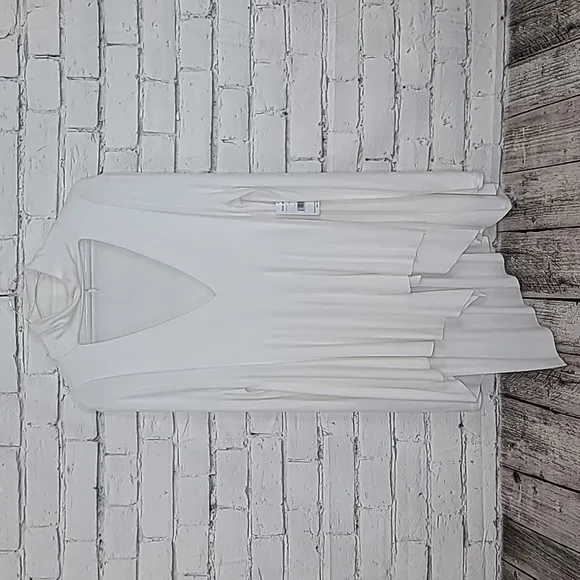 Free People Uptown Long Sleeve Cut Out Turtleneck Sweater Top in Ivory - NWT