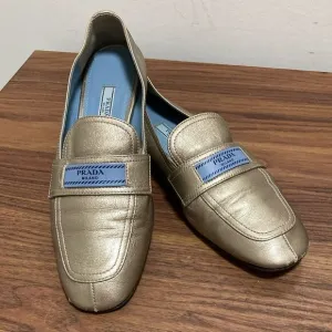 Prada Etiquette Metallic Gold Leather Loafer. Size 37.