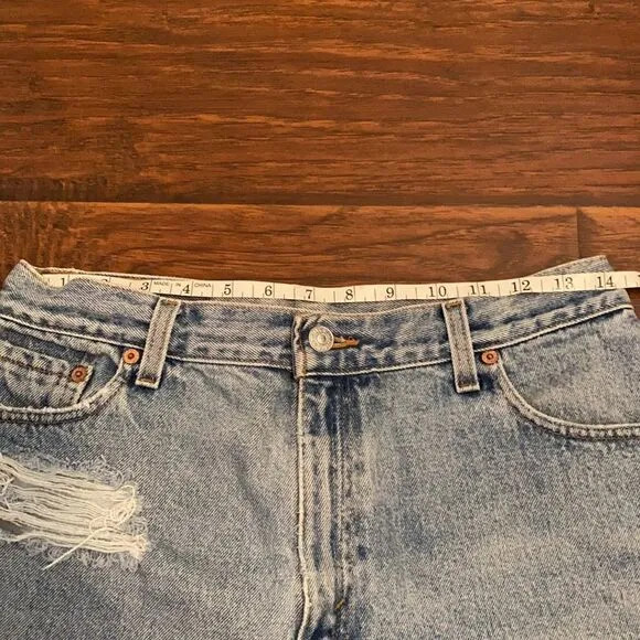 Vintage Levi’s Blue Denim Distressed Man Made Cutoff Raw Hem Shorts Casual