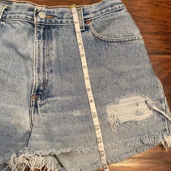 Vintage Levi’s Blue Denim Distressed Man Made Cutoff Raw Hem Shorts Casual
