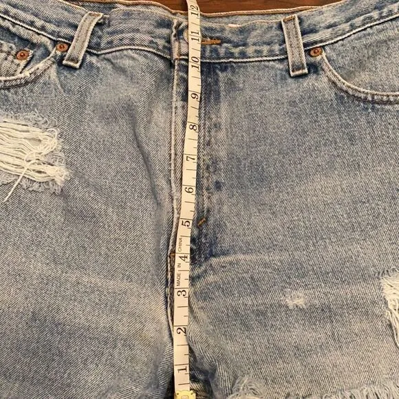 Vintage Levi’s Blue Denim Distressed Man Made Cutoff Raw Hem Shorts Casual